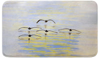 Cruising Pelicans Bath Mat
