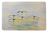 Cruising Pelicans Door Mat